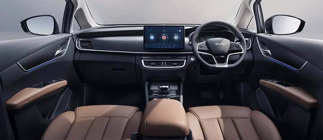 BYD M6 dashboard and cockpit featuring touchscreen display, brown leather seats and modern interior design elements.