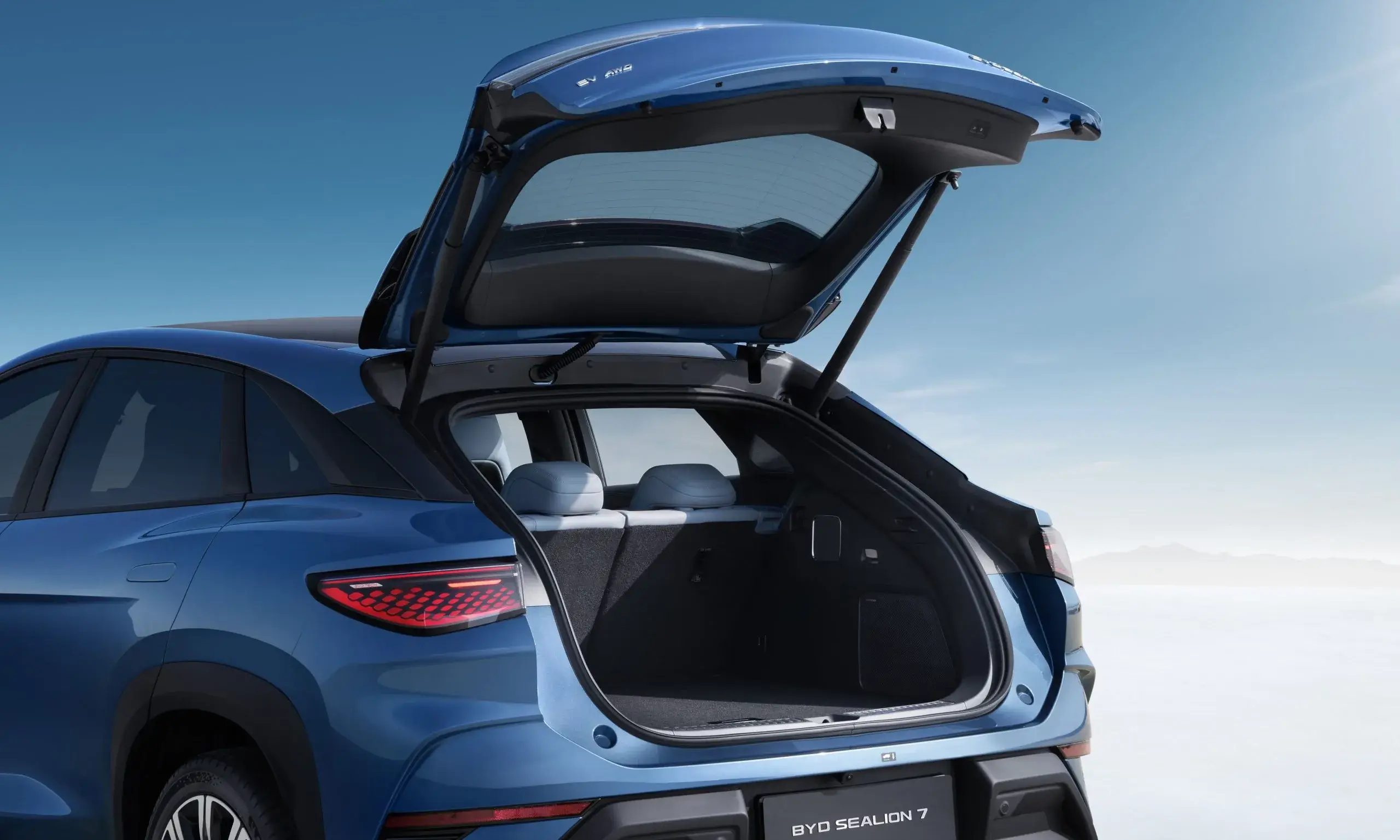BYD SEALION 7 electric SUV with rear hatch open displaying spacious cargo area and storage compartment